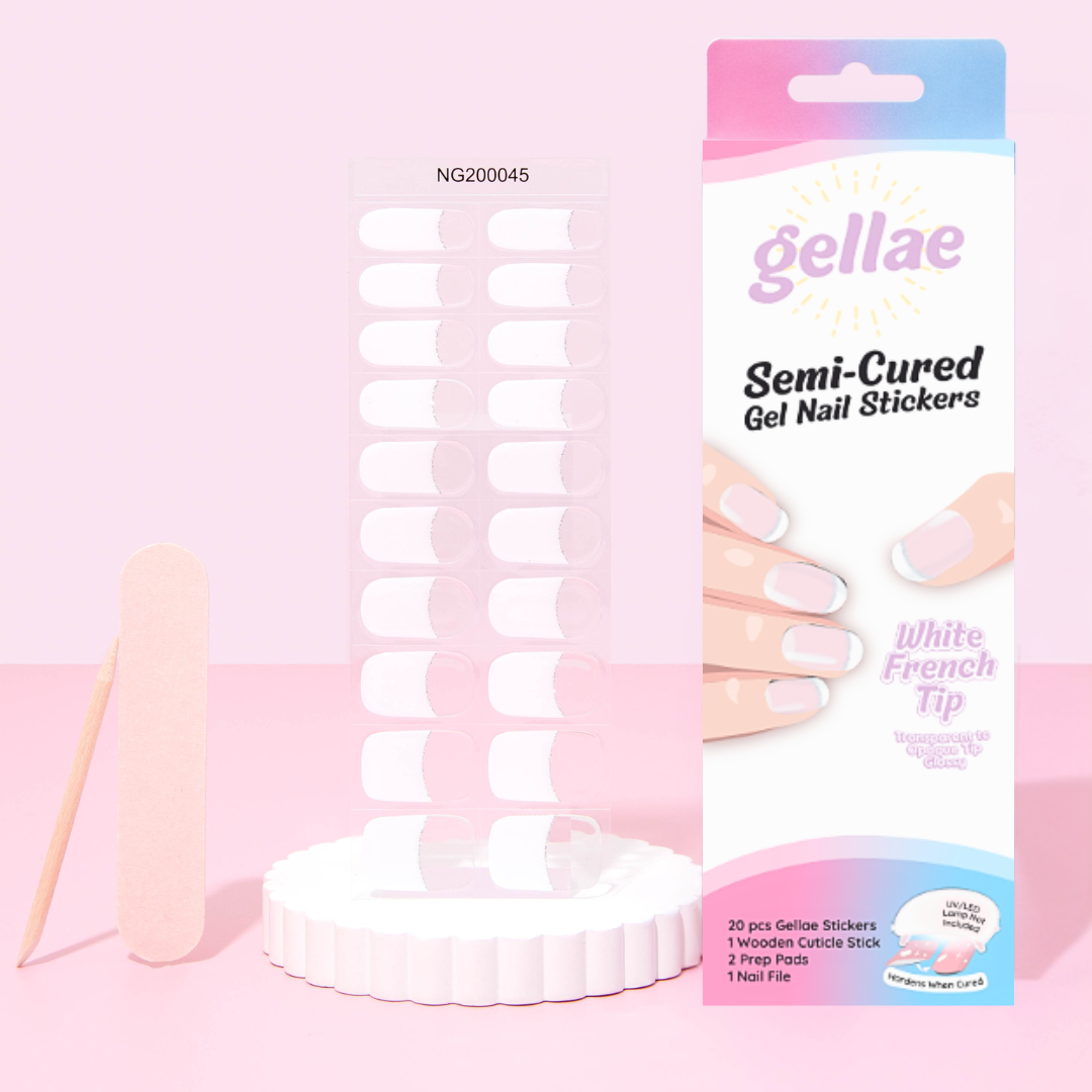 Gellae semi-cured gel nail stickers in a white French tip style, shown with a clear display stand, wooden cuticle stick, and retail packaging on a soft pink background.